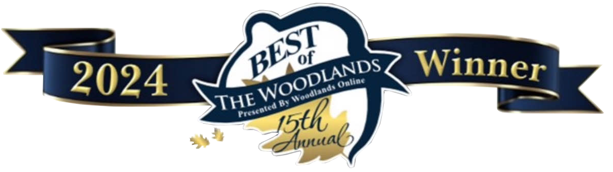 An award ribbon graphic with text "best of the woodlands 2014 winner" highlighted in blue and gold colors on a distorted digital background, featuring a new web design layout.