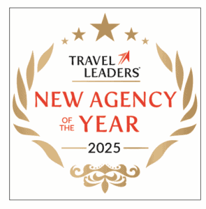 Header Theme Layout showcases the Travel Leaders New Agency of the Year 2025 award logo, featuring gold laurel leaves, stars, and bold red text on a crisp white background.