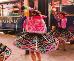 Peruvian dancers enjoying a vacation on a train.