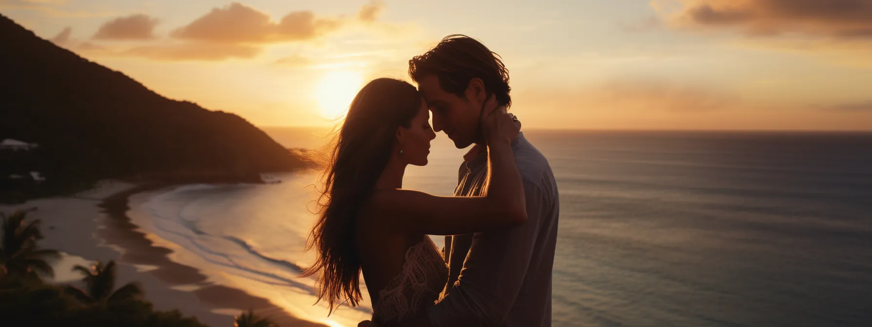 A couple enjoying a romantic sunset kiss at a beach resort.