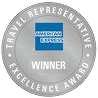 Silver circular badge with the American Express logo in the center. Text reads "Travel Representative Excellence Award" and "Winner." Celebrating turning 40, this award symbolizes decades of dedication and excellence.
